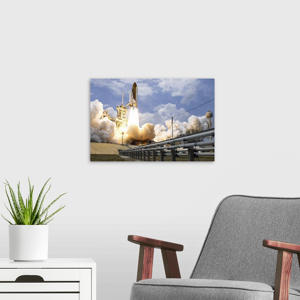 A modern room featuring Space Shuttle Atlantis lifts off from its launch pad