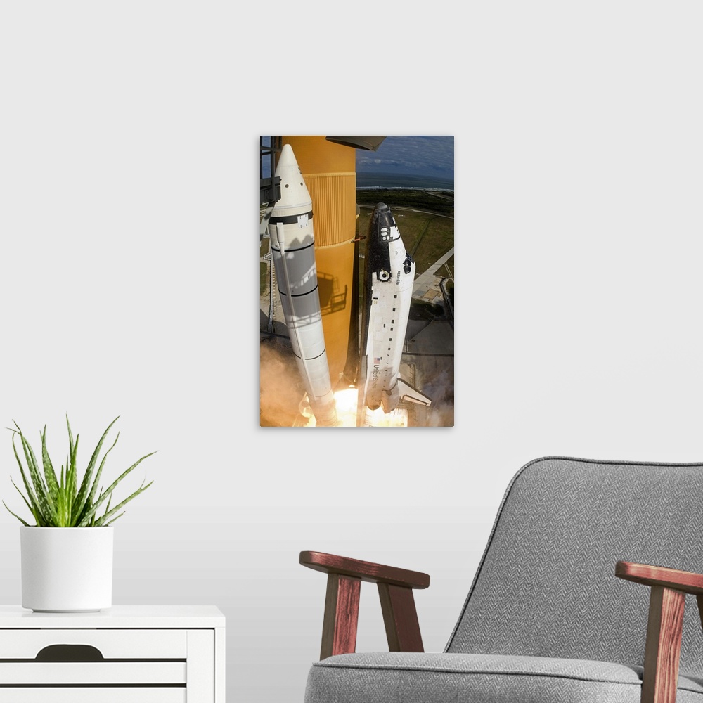 A modern room featuring Space Shuttle Atlantis lifts off from its launch pad at Kennedy Space Center Florida