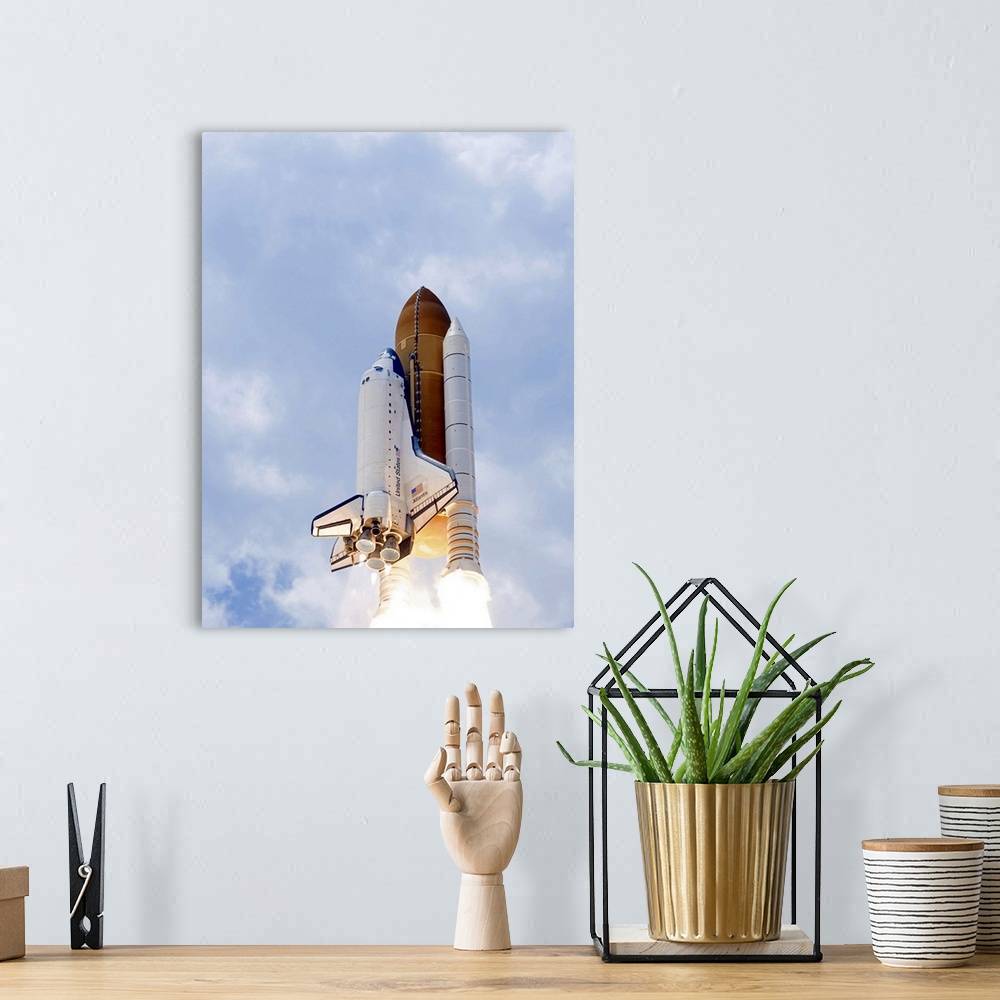 A bohemian room featuring Space Shuttle Atlantis lifts off from its launch pad toward Earth orbit