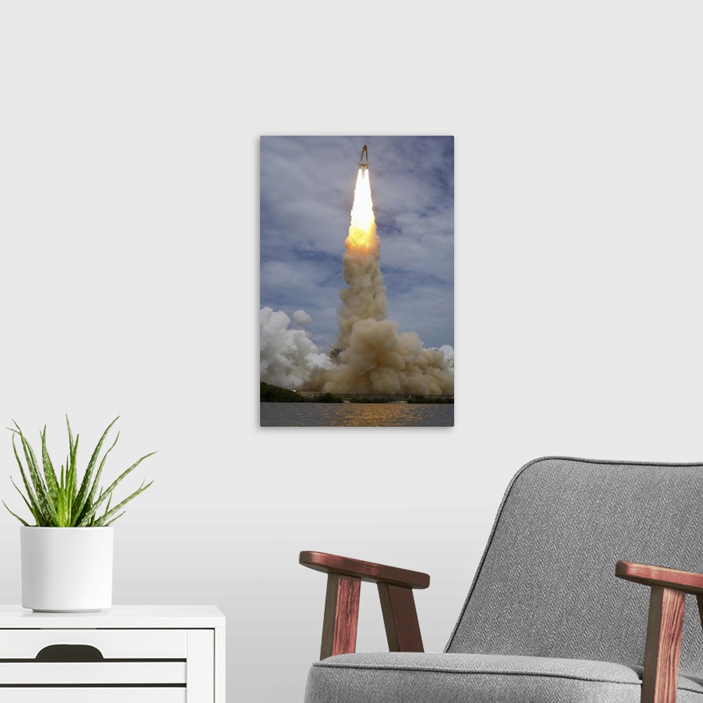 A modern room featuring July 8, 2011 - Space shuttle Atlantis is seen as it launches from pad 39A at the Kennedy Space Ce...