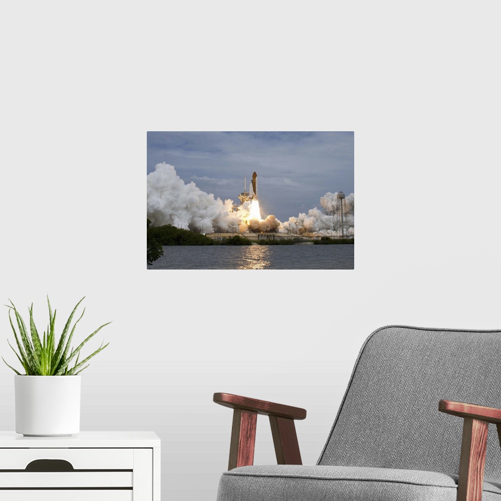 A modern room featuring July 8, 2011 - Space shuttle Atlantis is seen as it launches from pad 39A at the Kennedy Space Ce...