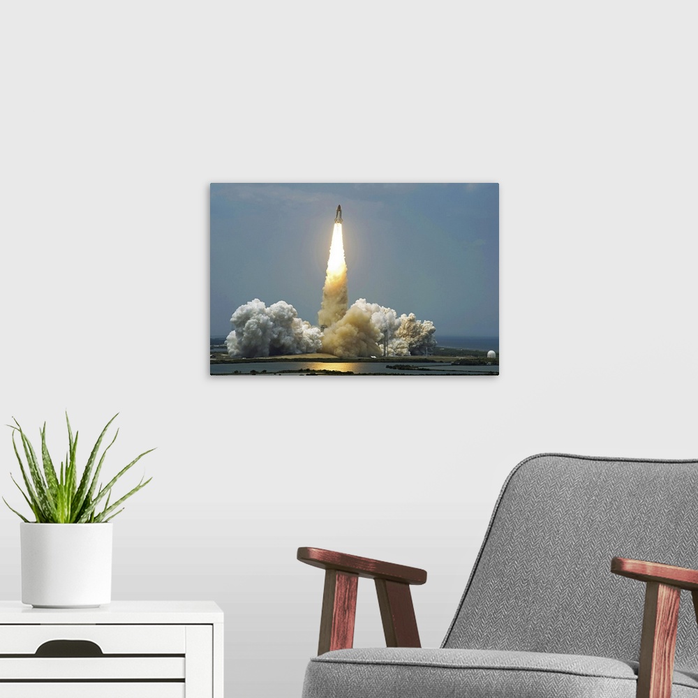 A modern room featuring Space Shuttle Atlantis lifts off into the sky