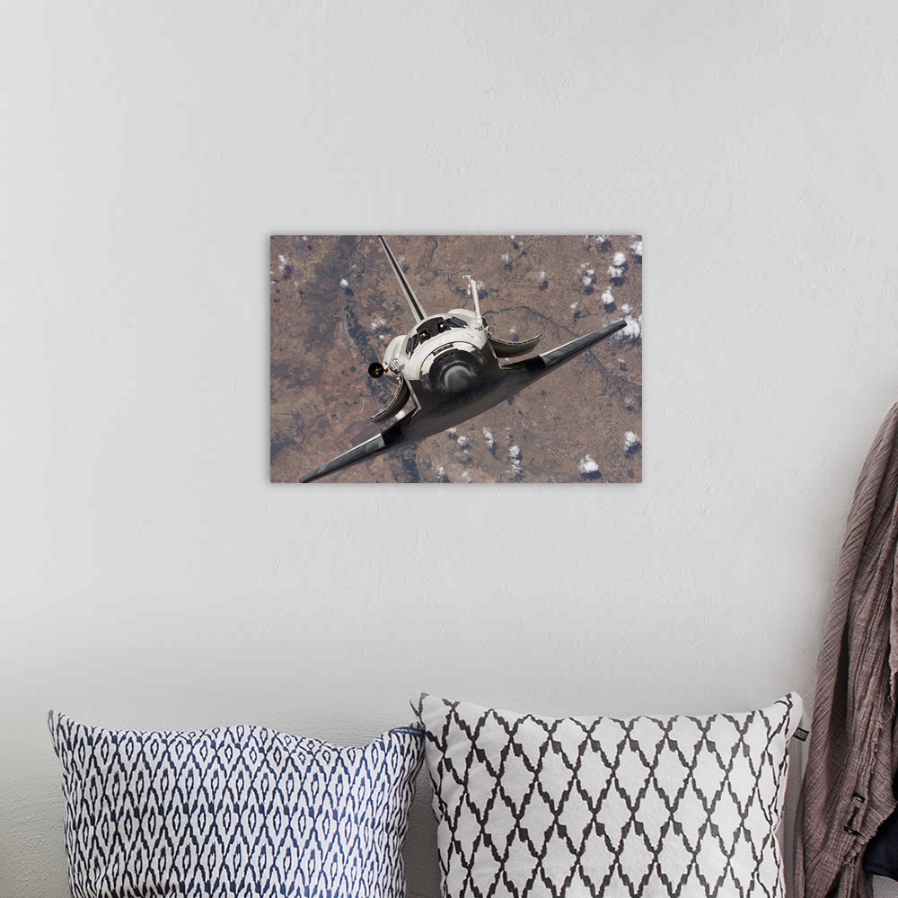 A bohemian room featuring Space Shuttle Discovery
