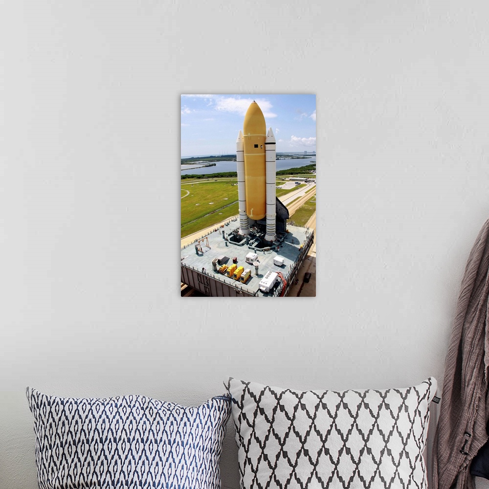 A bohemian room featuring Space Shuttle Discovery atop the mobile launcher platform