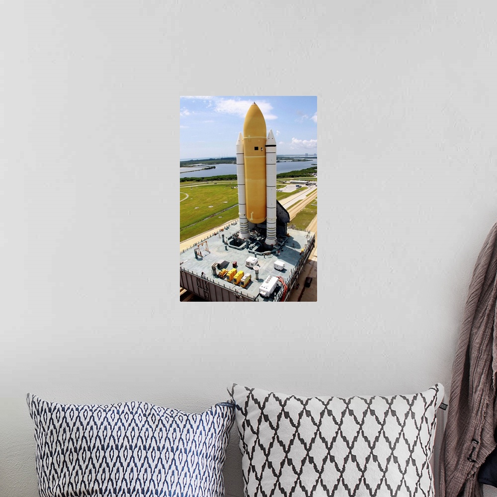 A bohemian room featuring Space Shuttle Discovery atop the mobile launcher platform