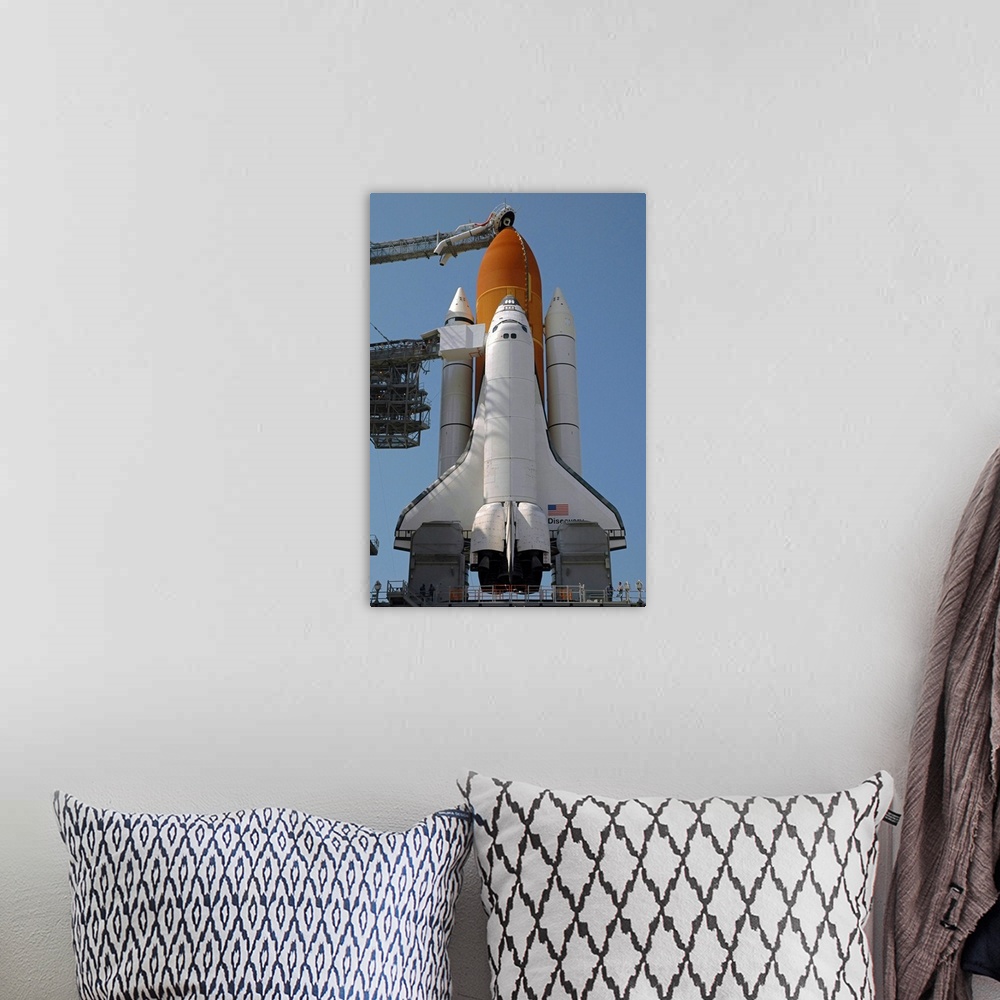 A bohemian room featuring Space Shuttle Discovery in full launch configuration