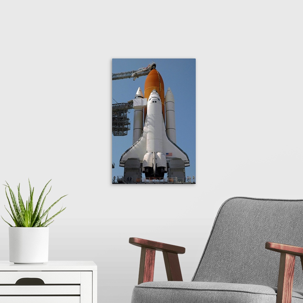 A modern room featuring Space Shuttle Discovery in full launch configuration