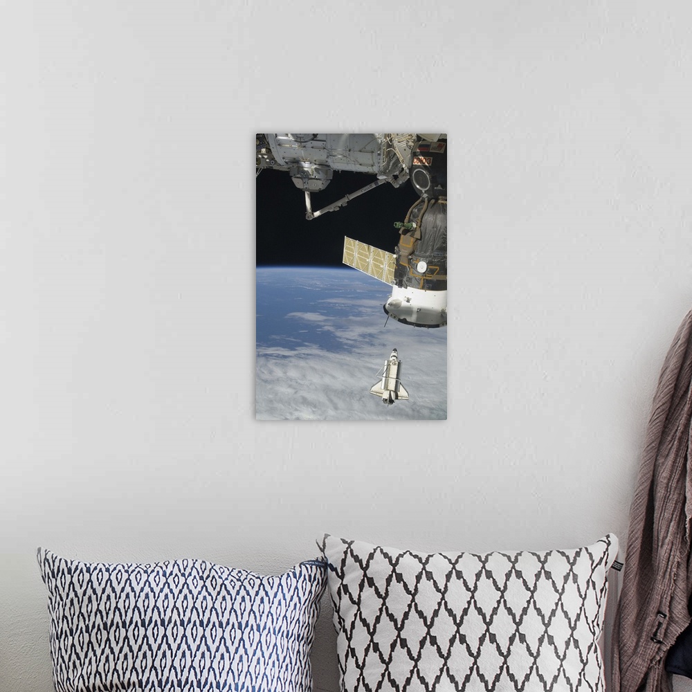 A bohemian room featuring Space shuttle Endeavour a Soyuz spacecraft and the International Space Station