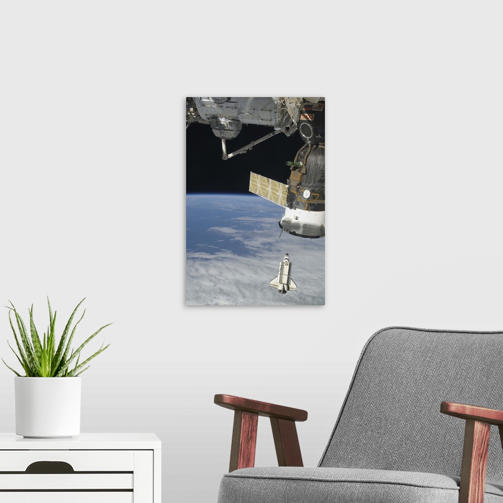 A modern room featuring Space shuttle Endeavour a Soyuz spacecraft and the International Space Station