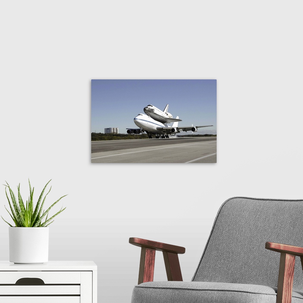 A modern room featuring Space Shuttle Endeavour mounted on a modified Boeing 747 shuttle carrier aircraft