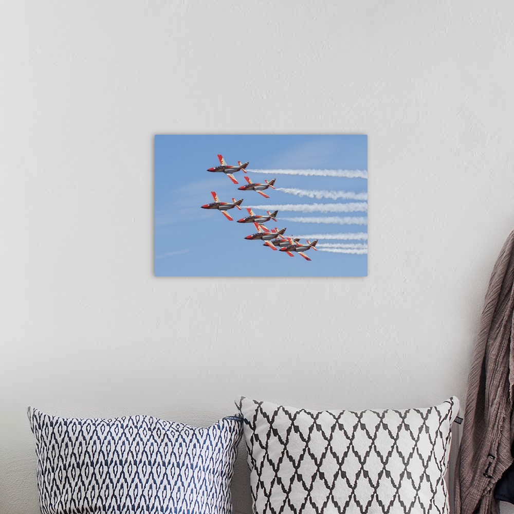 A bohemian room featuring Spanish aerobatic team Patrulla Aguila with their C-101EB planes, performing at the International...
