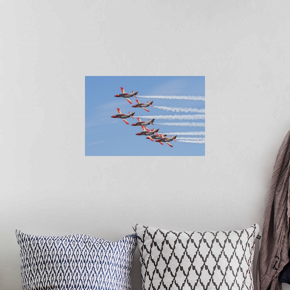 A bohemian room featuring Spanish aerobatic team Patrulla Aguila with their C-101EB planes, performing at the International...