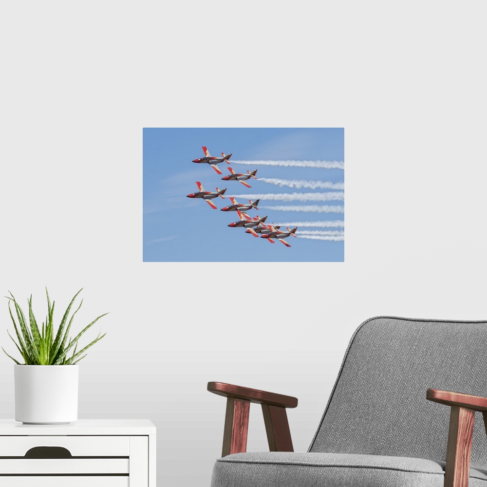 A modern room featuring Spanish aerobatic team Patrulla Aguila with their C-101EB planes, performing at the International...