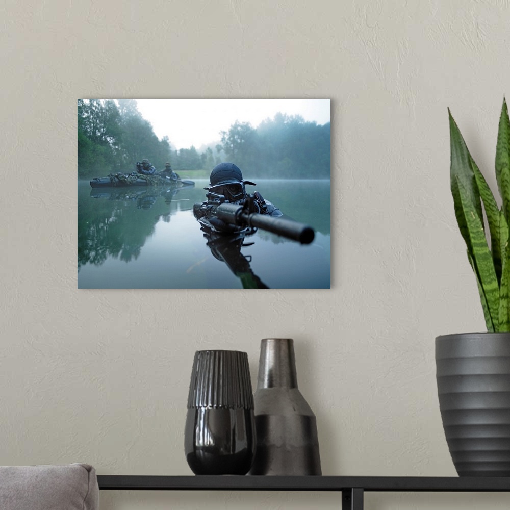 A modern room featuring Landscape photograph of a special operations forces combat diver just above foggy water,  armed w...
