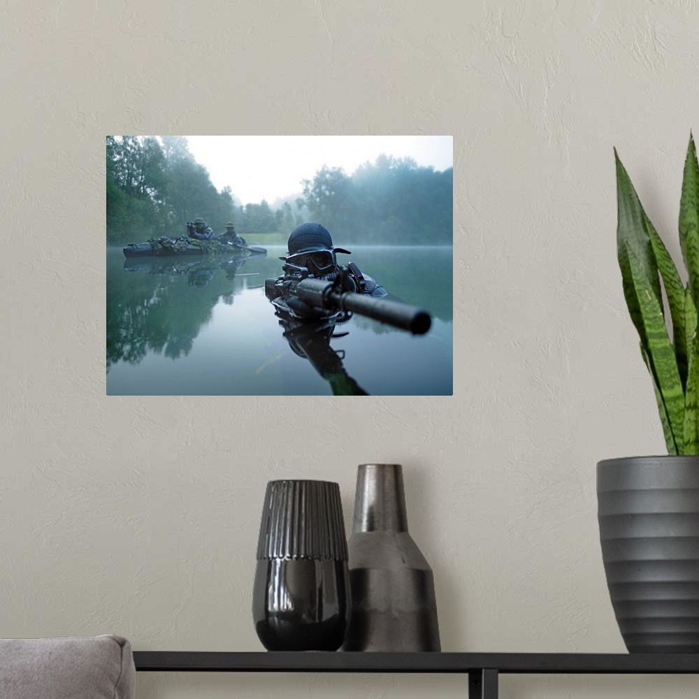 A modern room featuring Landscape photograph of a special operations forces combat diver just above foggy water,  armed w...