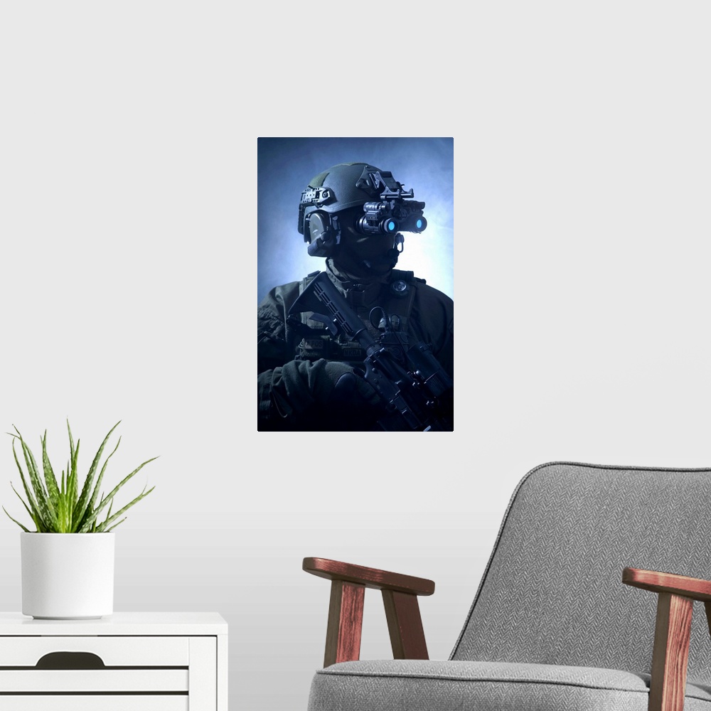A modern room featuring Special operations forces soldier equipped with night vision and an automatic weapon.