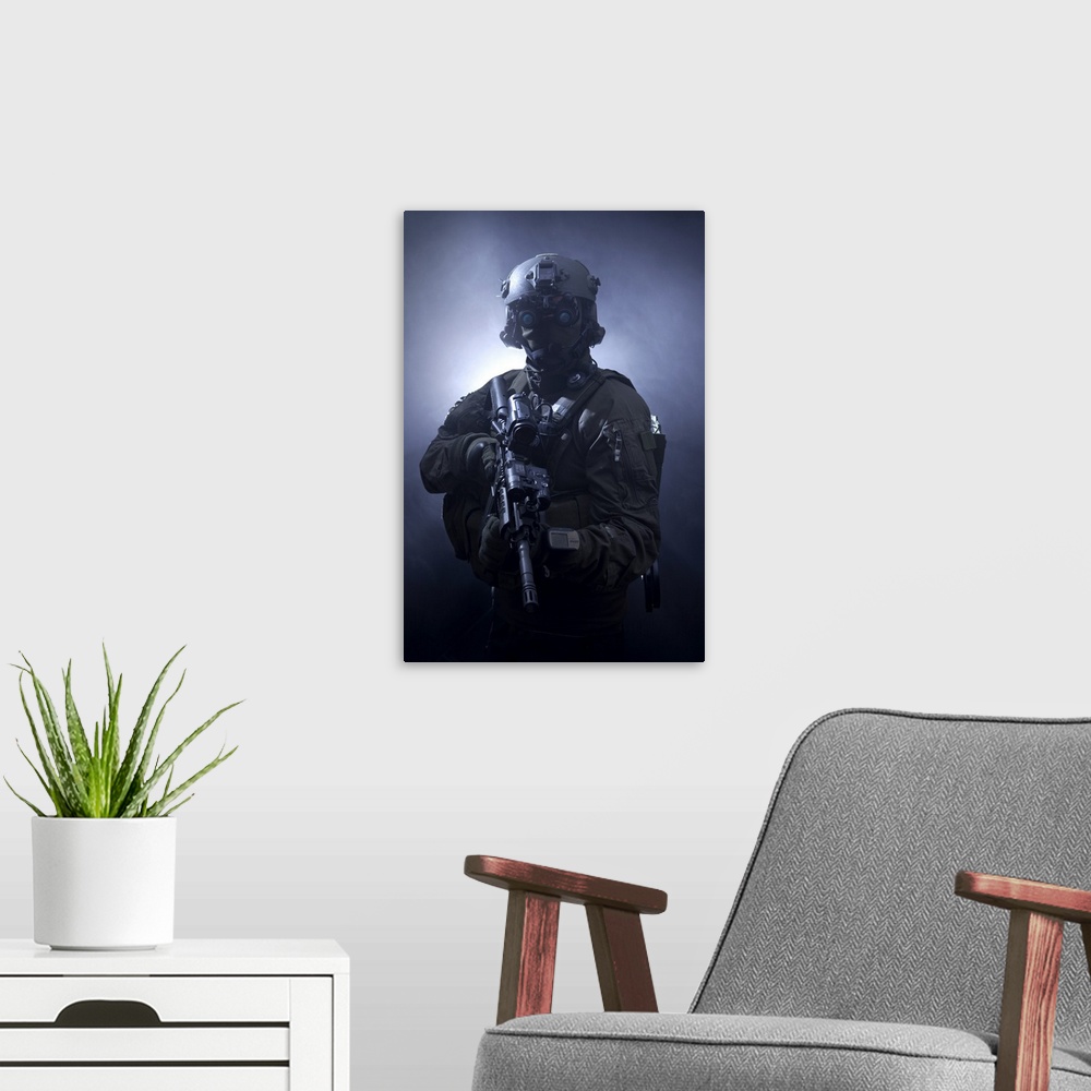 A modern room featuring Special operations forces soldier equipped with night vision and an automatic weapon.