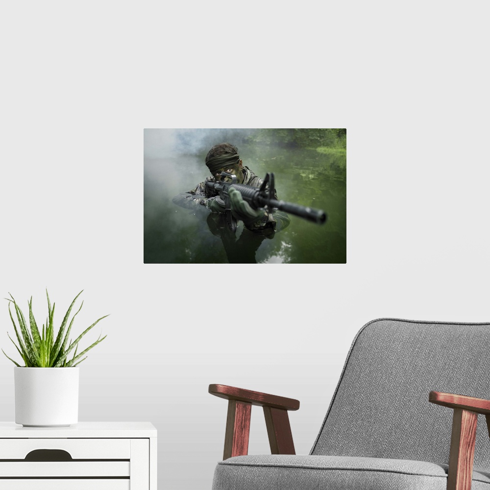 A modern room featuring Special operations forces soldier transits the water armed with an assault rifle.