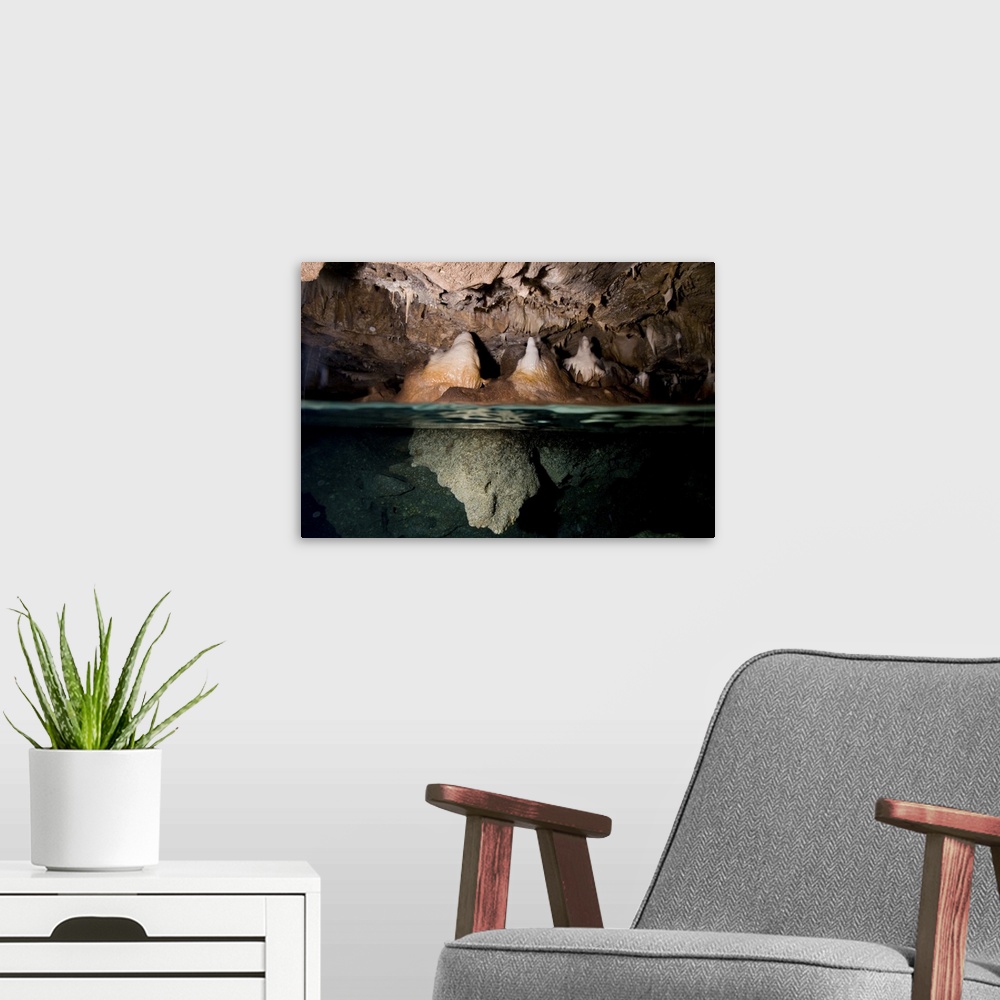 A modern room featuring Split shot of stalactites and stalagmites in a cave, Australia.