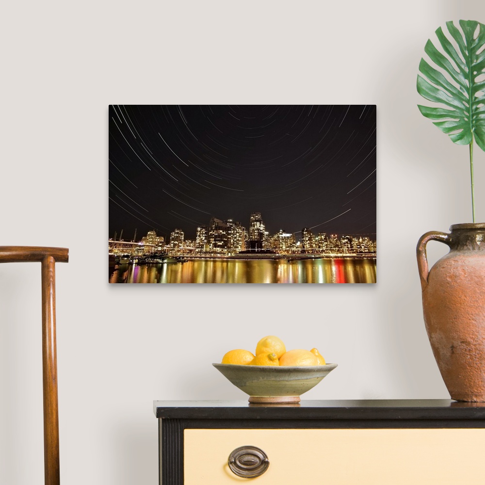 A traditional room featuring Landscape, big photograph of the Vancouver skyline at night, under a large sky with circular patt...