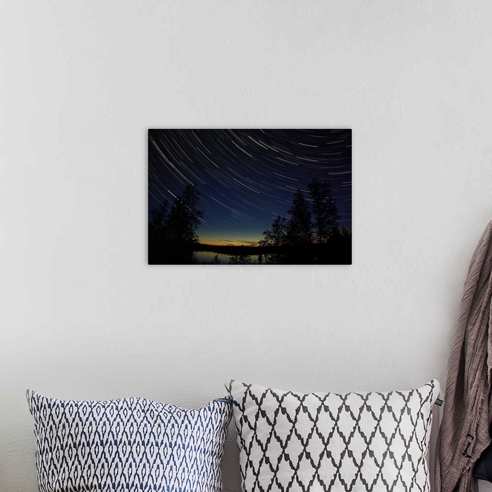 A bohemian room featuring Star trails at dusk