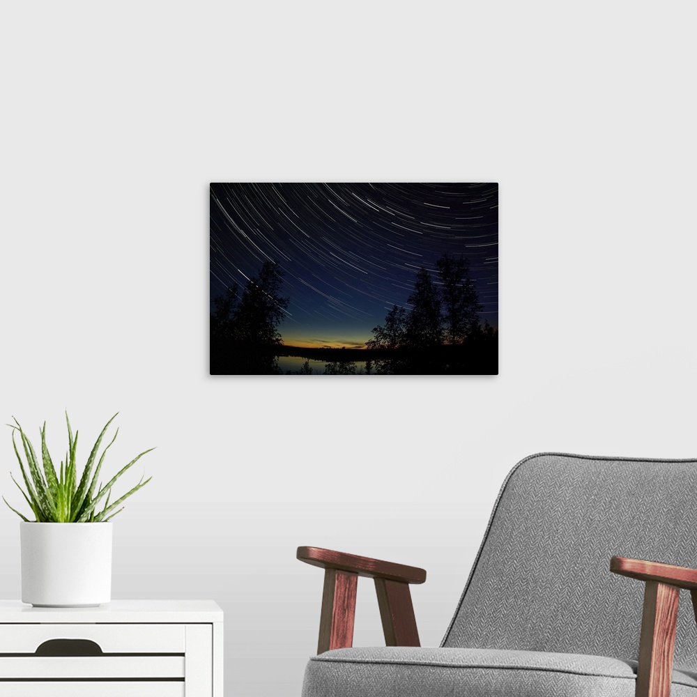 A modern room featuring Star trails at dusk