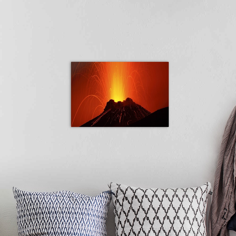 A bohemian room featuring Photograph of an erupting volcano on the Aeolian Islands in Italy.