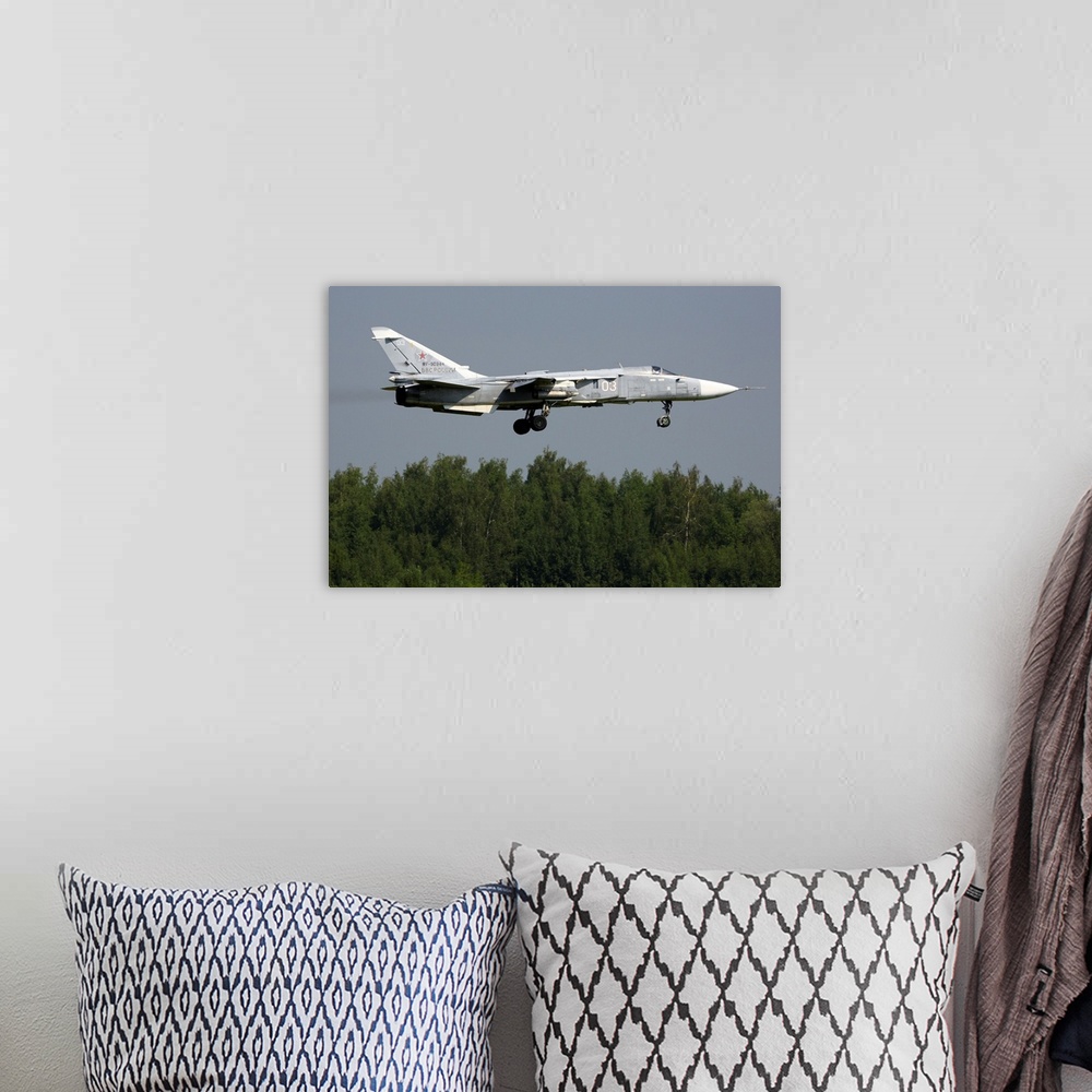 A bohemian room featuring Su-24M attack airplane of Russian Air Force landing.