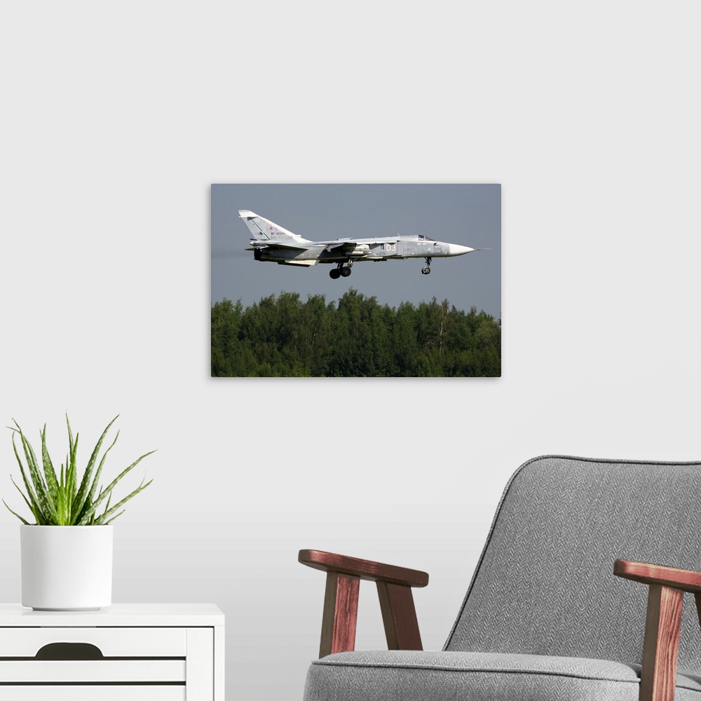 A modern room featuring Su-24M attack airplane of Russian Air Force landing.