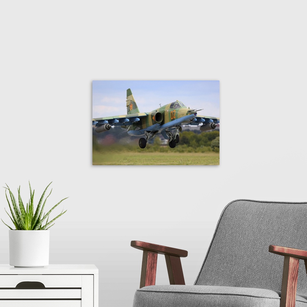 A modern room featuring Sukhoi Su-25 attack airplane of Kazakhstan Air Force taking off during Aviadarts 2019 exercise in...