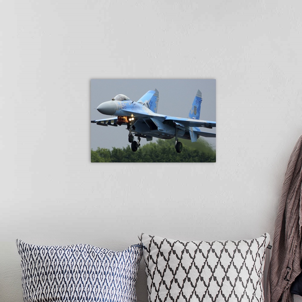 A bohemian room featuring Sukhoi Su-27 jet fighter of the Ukrainian Air Force landing during RIAT-2017 airshow, Fairford, E...