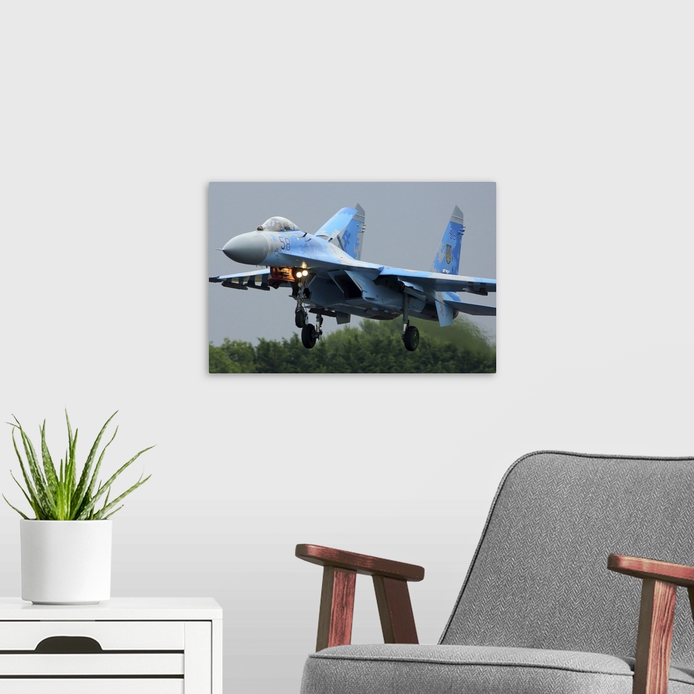 A modern room featuring Sukhoi Su-27 jet fighter of the Ukrainian Air Force landing during RIAT-2017 airshow, Fairford, E...