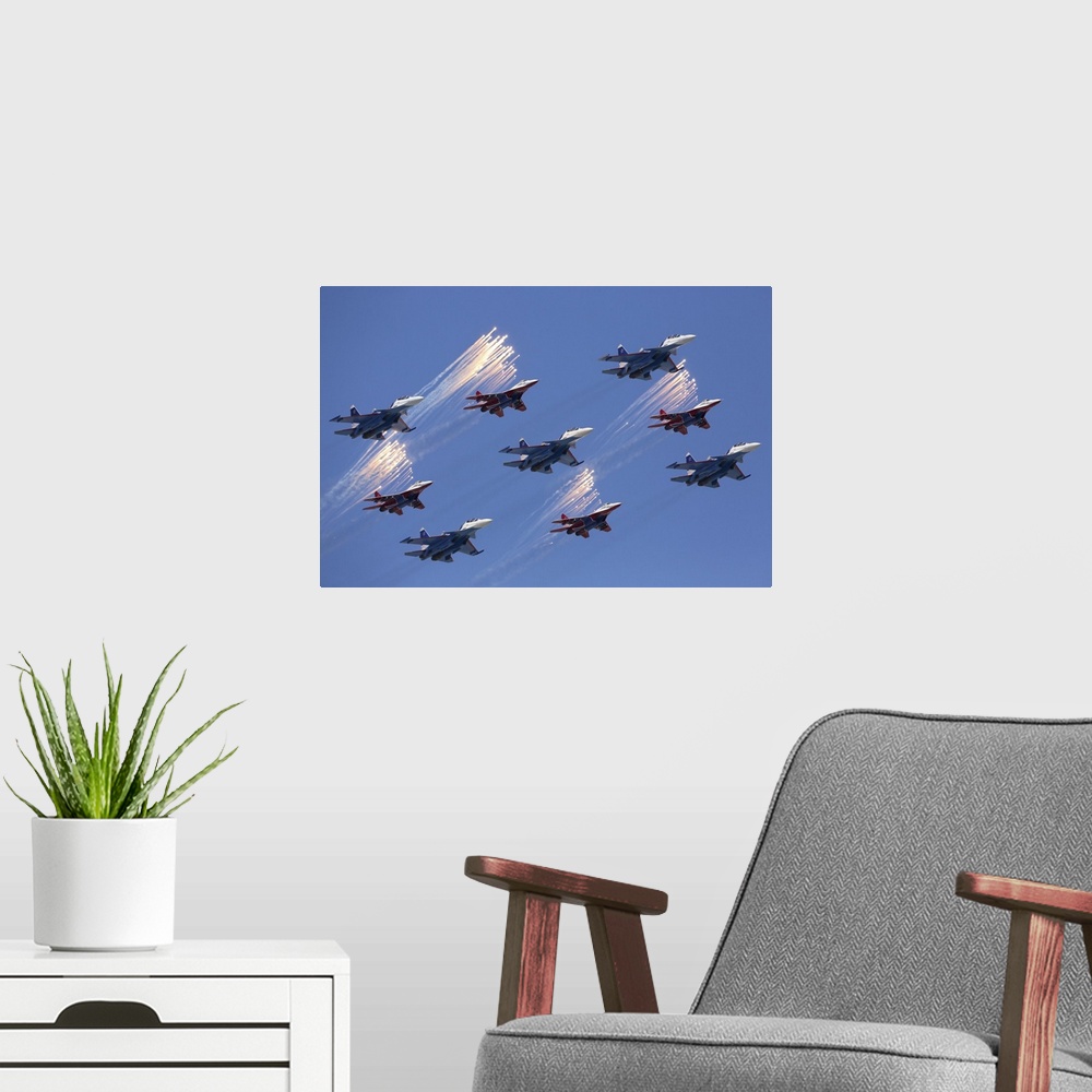 A modern room featuring Sukhoi Su-30SM jet fighters of the Russian Knights aerobatics team during parade rehearsal, Mosco...