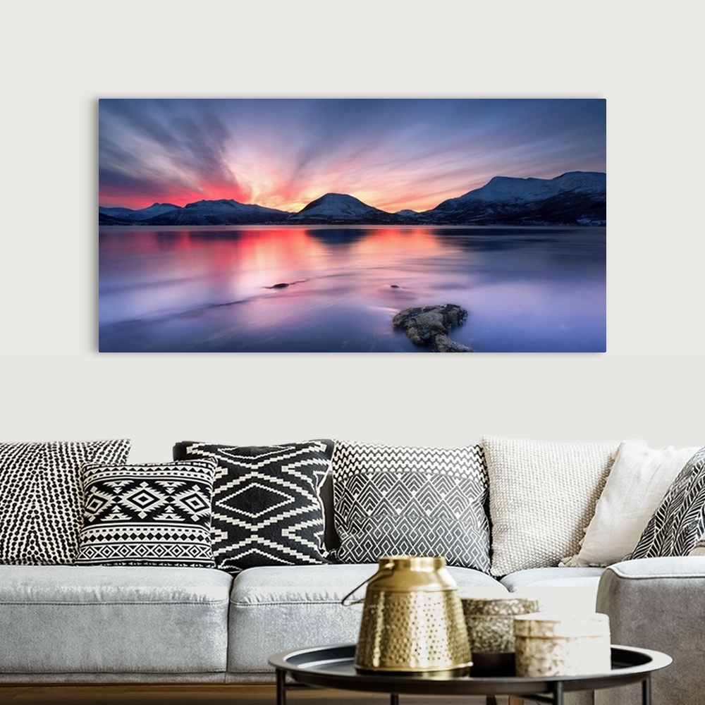 A bohemian room featuring Sunset over Tjeldsundet, Troms County, Norway. Saetertinden and Harberget Mountains are visible i...