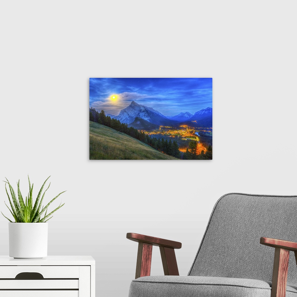 A modern room featuring August 10, 2014 - High dynamic range photo of the supermoon rising behind Mt. Rundle and Banff to...