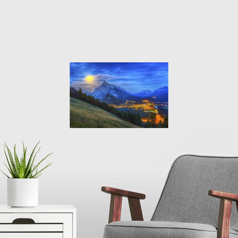 A modern room featuring August 10, 2014 - High dynamic range photo of the supermoon rising behind Mt. Rundle and Banff to...
