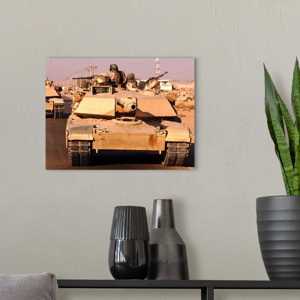 A modern room featuring Tankers return safely to Camp Warhorse.