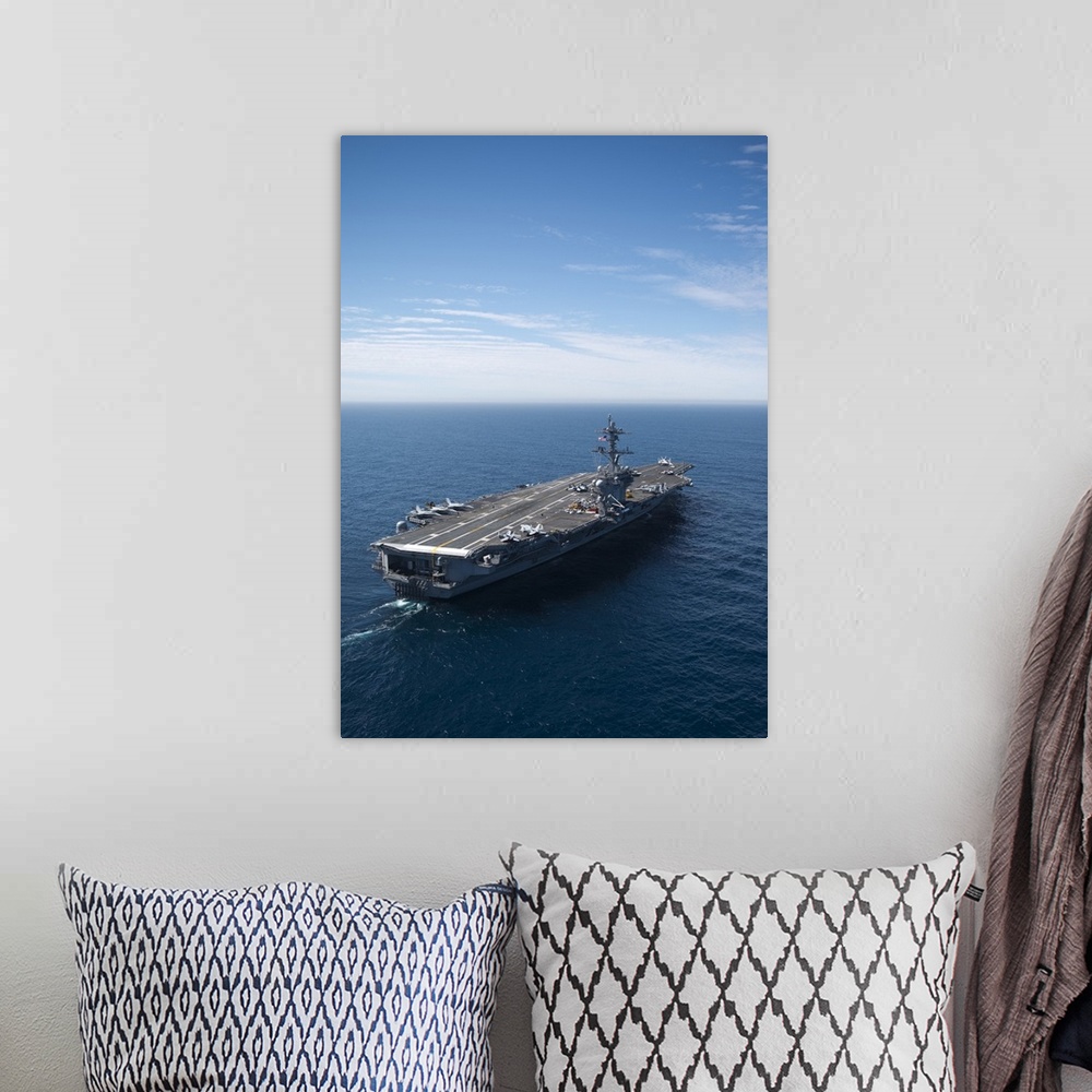 A bohemian room featuring The aircraft carrier USS Carl Vinson in the Pacific Ocean.