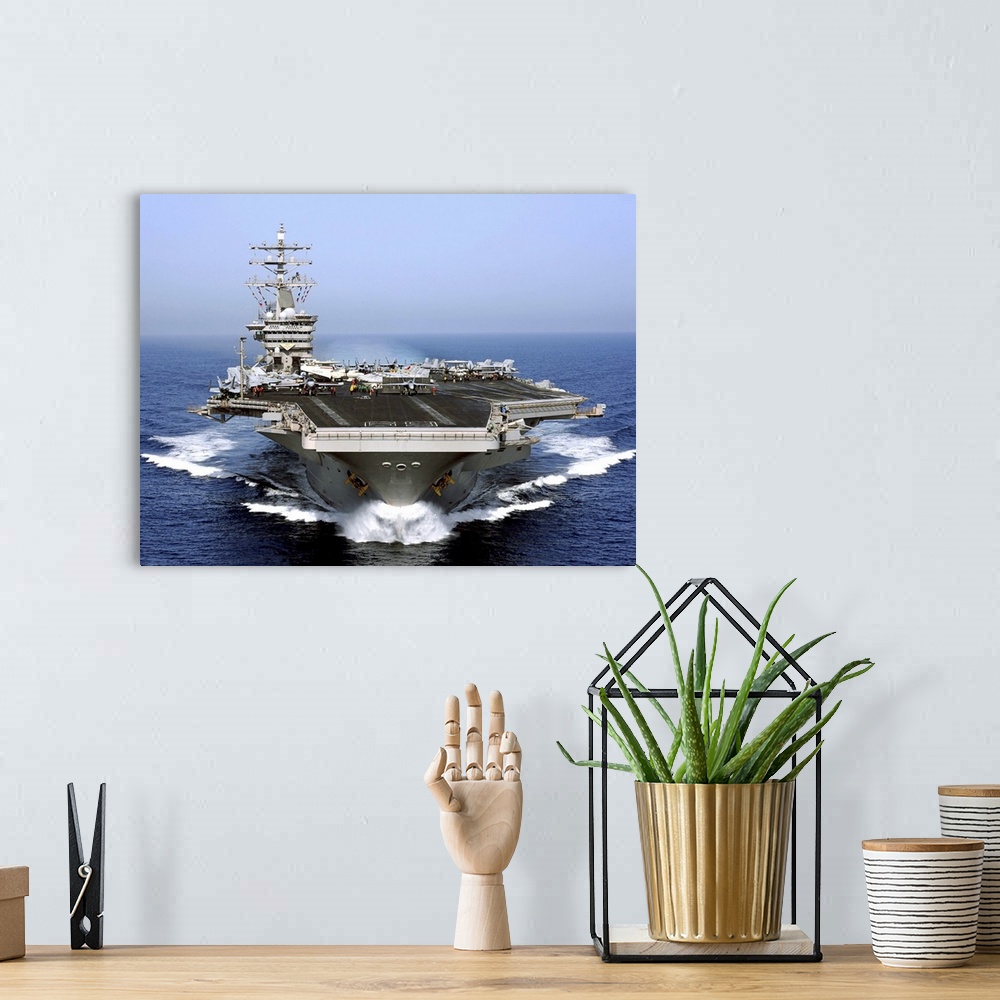 A bohemian room featuring The aircraft carrier USS Dwight D. Eisenhower transits the Arabian Sea.
