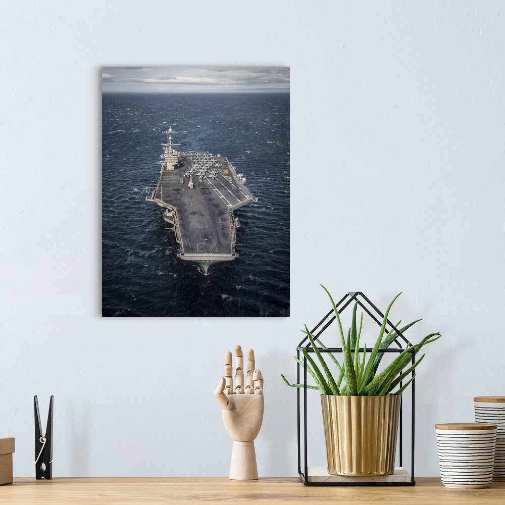 A bohemian room featuring The aircraft carrier USS George Washington transits the Strait of Magellan.