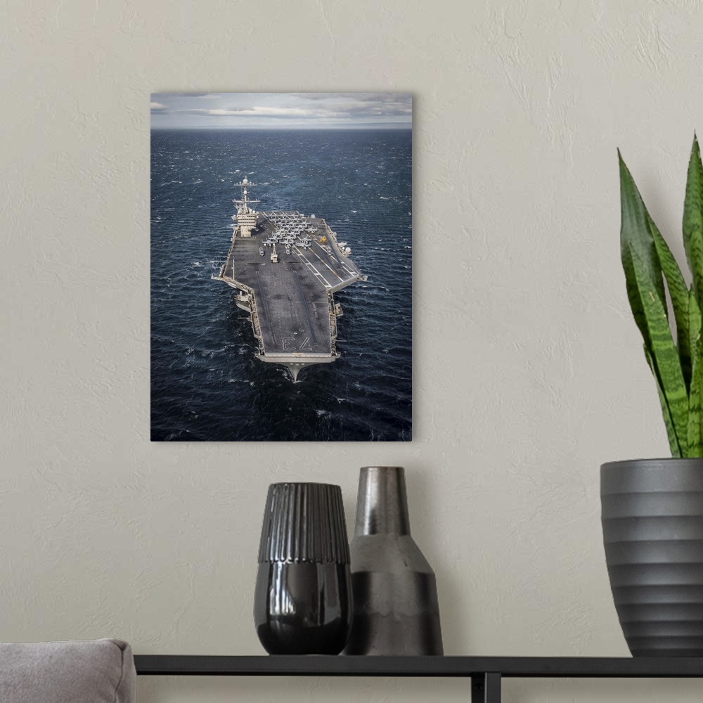 A modern room featuring The aircraft carrier USS George Washington transits the Strait of Magellan.