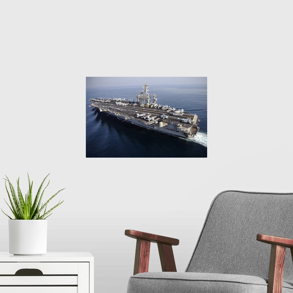 A modern room featuring Arabian Gulf, August 13, 2013 - The aircraft carrier USS Nimitz (CVN-68) is underway in the Arabi...
