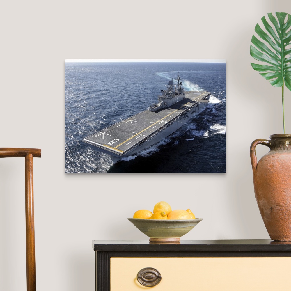 A traditional room featuring The amphibious assault ship USS Makin Island in the Gulf of Mexico.