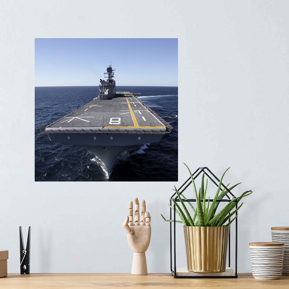 A bohemian room featuring The amphibious assault ship USS Makin Island in the Gulf of Mexico.