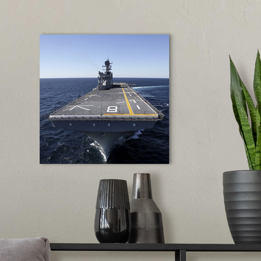 A modern room featuring The amphibious assault ship USS Makin Island in the Gulf of Mexico.