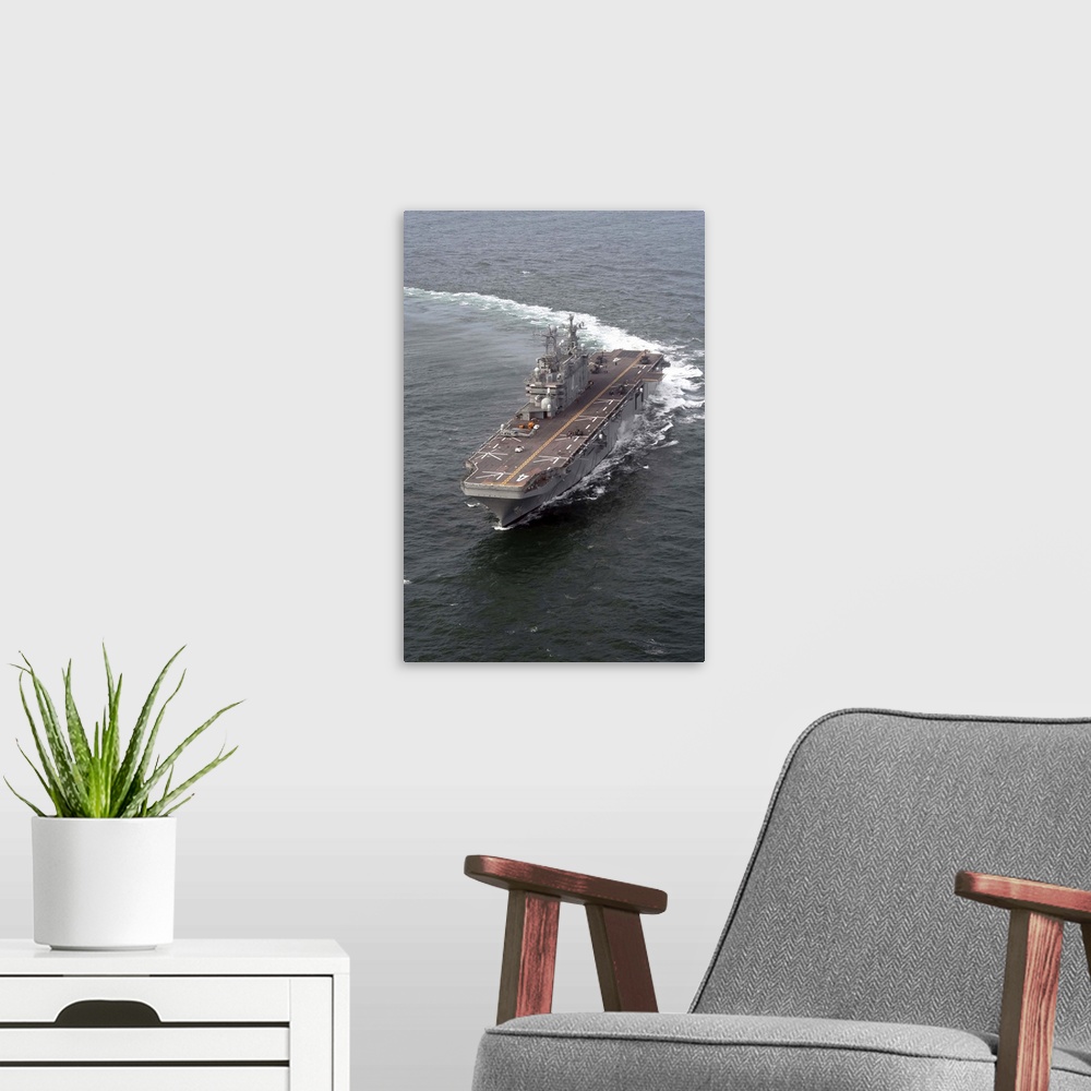 A modern room featuring The amphibious assault ship USS Nassau.