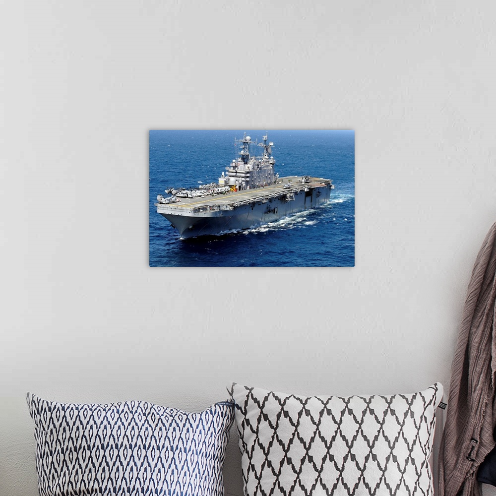 A bohemian room featuring The amphibious assault ship USS Peleliu in transit in the Pacific Ocean.