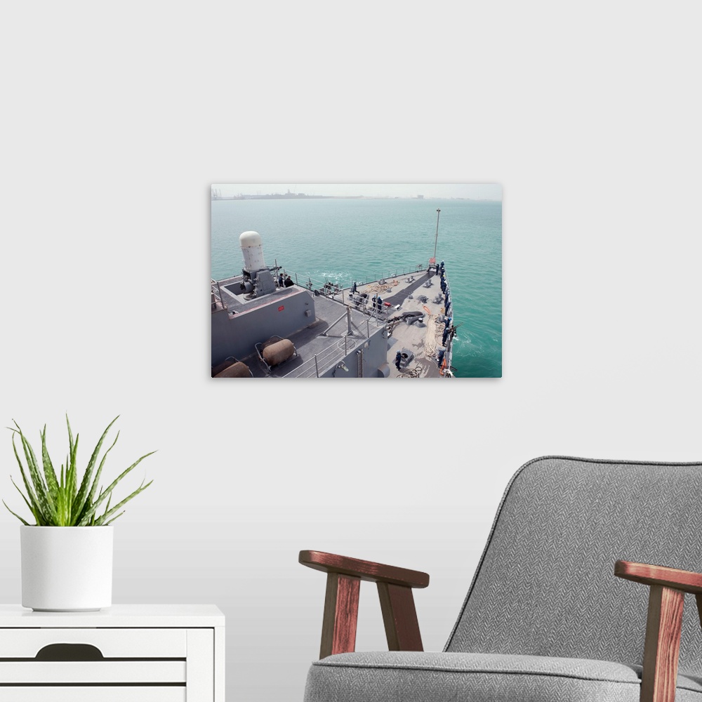 A modern room featuring The amphibious dock landing ship USS Pearl Harbor.