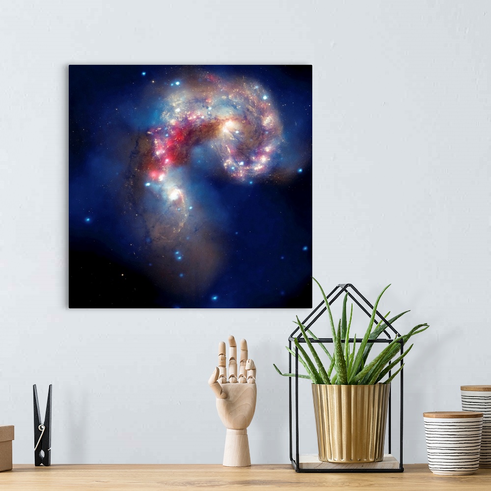 A bohemian room featuring Composite image of two colliding galaxies, known as the Antennae galaxies, or NGC 4038 and NGC 40...