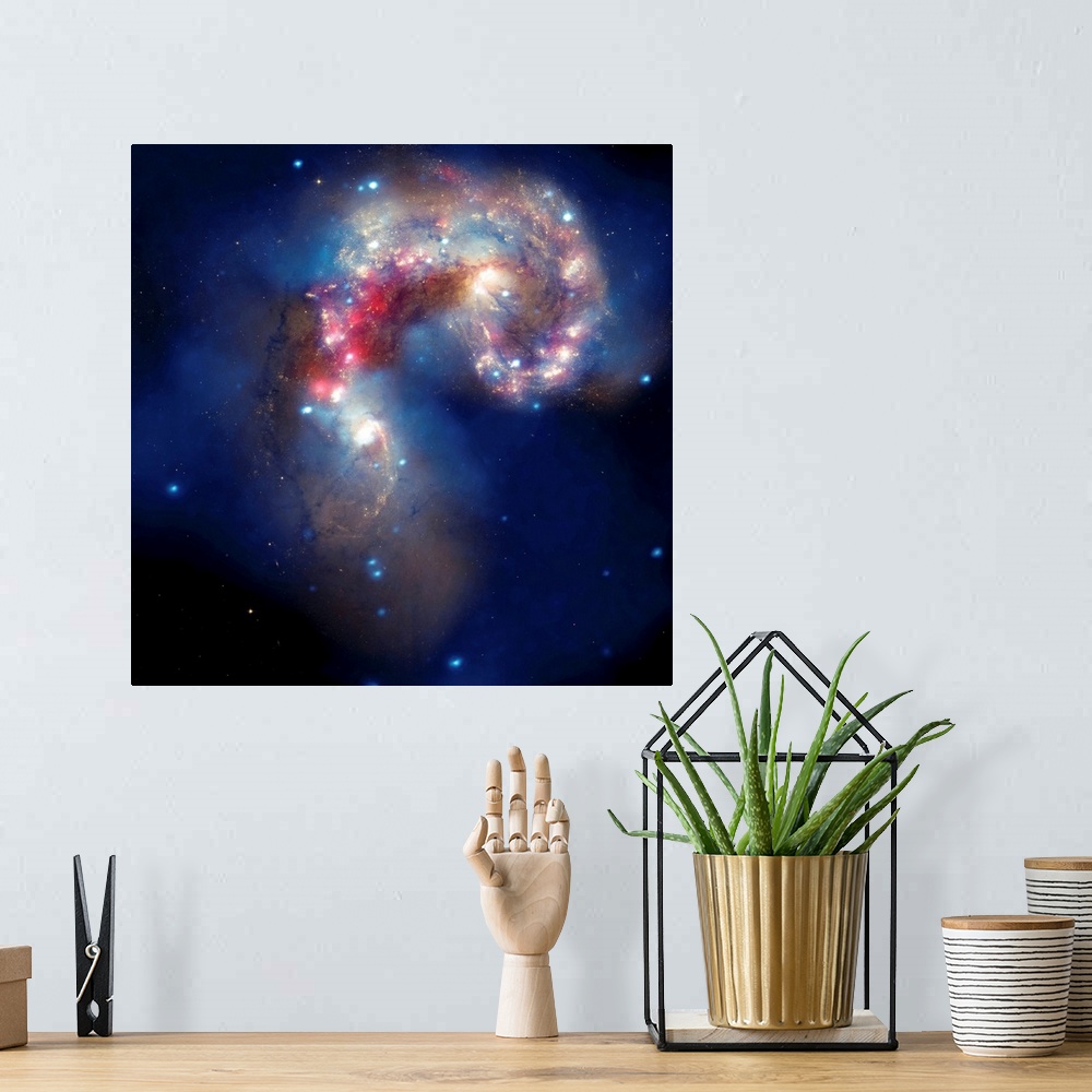 A bohemian room featuring Composite image of two colliding galaxies, known as the Antennae galaxies, or NGC 4038 and NGC 40...